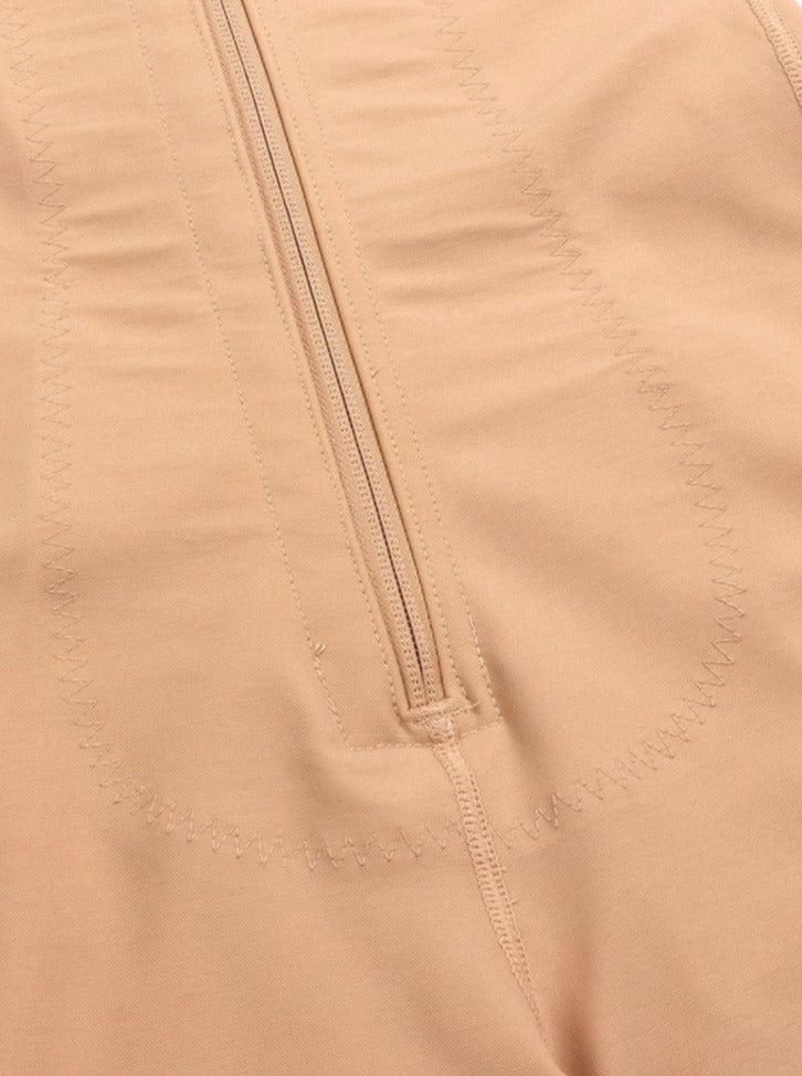 Gaine intégrale avec panneau abdominal en latex